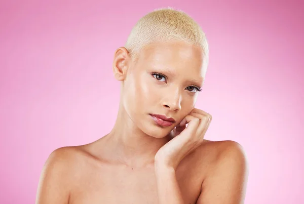 Portrait, beauty and cosmetics with a model black woman in studio on a pink background for edgy makeup. Face, skincare or natural with a unique and attractve young female indoor for cosmetic care.