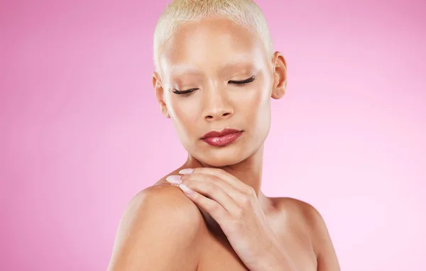 Face, beauty skincare and black woman in studio isolated on a pink background. Makeup, cosmetics and young female model or girl with glowing, healthy and flawless skin after spa facial treatment