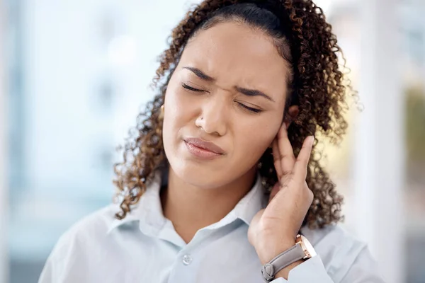 Injury, earache and medical with woman in pain for tinnitus, sound and noise problem. Healthcare, pressure and hearing loss with girl suffering with nerve infection for loud, deaf risk and illness.