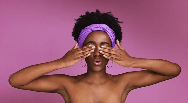 Black woman, afro or hands covering eyes on isolated studio background in surprise emoji, shock emotion or facial expression. Beauty model, wow or natural hair on skincare backdrop for treatment deal.