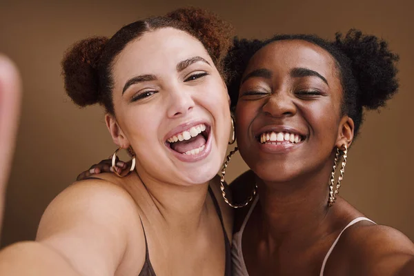 Beauty, friends and smile with selfie of black women for social media, skincare and fashion. Happy, skincare and picture with portrait of girls for cosmetics, makeup and young in brown background.