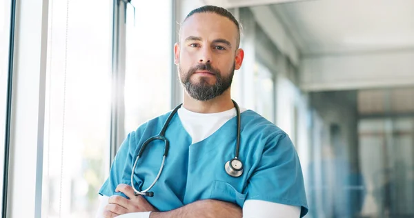 Healthcare worker, face or thinking nurse with arms crossed in hospital surgery ideas or life insurance vision. Portrait, man or medicine employee in trust innovation, help or medical wellness goals.