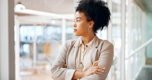 Face, thinking and black woman focussed in office workplace or company. Idea, planning and thinking, proud and pensive female employee lost in thoughts, nostalgic or contemplating good memory