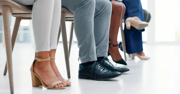 Business legs, recruitment and waiting room for Human Resources, we are hiring or appointment. Group of people feet or shoes nervous and corporate professional for career opportunity or job interview.