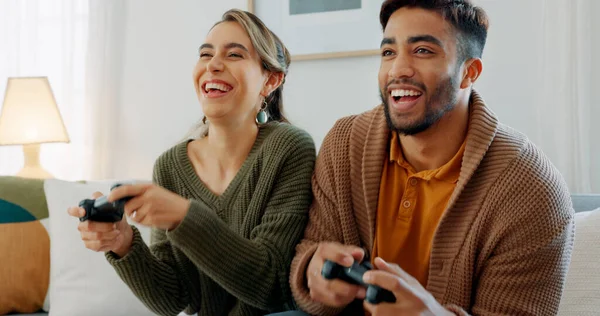 Video game, fun and excited diversity couple with crazy high energy, play together and enjoy quality bonding time at home. Entertainment technology, controller and competition for happy woman and man.