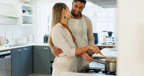 Couple, cooking and together in kitchen and learning for relationship growth and bonding, skill development and support. Young man, woman and cook Italian food, help and advice, spending quality time.