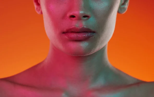 Woman, neon beauty and skincare with lips, mouth and aesthetic botox cosmetics on color background. Closeup female model, lip filler and face for plastic surgery, facial dermatology and cyberpunk art.
