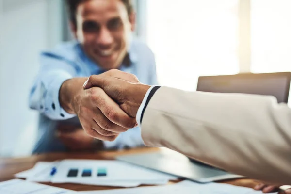 It was a pleasure doing business with you. Closeup shot of two businesspeople shaking hands in an office