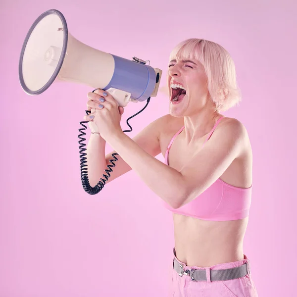 Woman, megaphone and gen z protest on pink background of speech, announcement and noise sound. Feminist broadcast voice for human rights, justice and fight of gender equality, opinion or revolution.