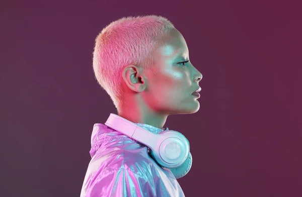 Cyberpunk headphones, black woman and fashion in studio, holographic beauty and vaporwave clothes. Futuristic model, young gen z and listening to music with neon aesthetic, audio technology and face.