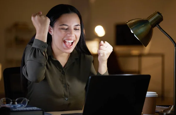 Business woman, laptop and office with celebration, winning and success on stock market with smile. Happy employee, winner and girl celebrate for profit in crypto, global investment or trading online.