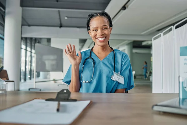 Portrait, black woman and doctor greeting, hospital and smile with success, medicine development and confidence. Face, African American female and medical professional with wave, healthcare and happy.
