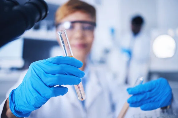 stock image Glass vials, science and female scientist doing research, experiment or tests in a medical lab. Innovation, professional and senior woman scientific researcher working in a pharmaceutical laboratory