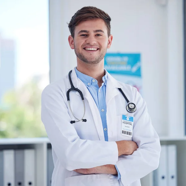 Happy, healthcare and portrait of doctor at hospital proud, empowered and confident. Face, leader and male health expert with positive mindset, goal or medical innovation at clinic, smile and excited.