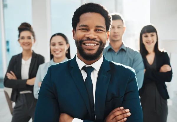 Portrait, black man and leadership for teamwork, collaboration and motivation in office. Happy group of employees, diversity and arms crossed for success, business goals or smile of corporate mission.