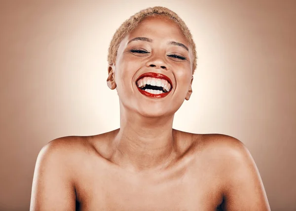 Makeup, portrait and black woman laughing with red lipstick on a brown background for beauty. Aesthetic model person in studio for skincare, cosmetics and facial glow on skin for funny backdrop.