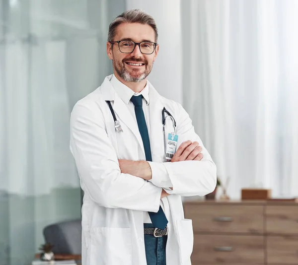 Healthcare, smile and portrait of doctor, man in hospital for support, success and help in medical work. Health, wellness and medicine, confident mature professional with stethoscope and leadership