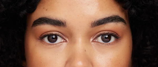 Eyes, eyebrow and beauty with face, microblading and black woman in closeup, makeup and lashes with vision. Dermatology, optometry and eye care with skincare, natural cosmetics and cosmetology.