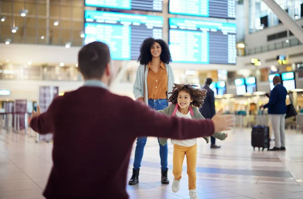 Child running to father at airport for welcome home travel and reunion after immigration or international opportunity. Interracial family, dad and girl kid run for hug excited to see papa in lobby.