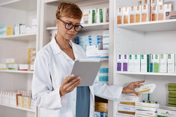 Tablet, pharmacy woman and medicine shelf to check inventory and product information search. Pharmacist person Pharma app in clinic or shop for pharmaceutical, medical and health care consultation.