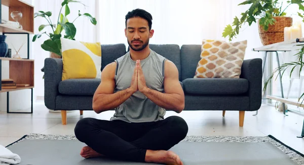 Yoga, namaste man and living room exercise for zen meditation and mental relaxation time in home. Peaceful, spiritual and fitness wellness routine for calm mindset and stress free lifestyle