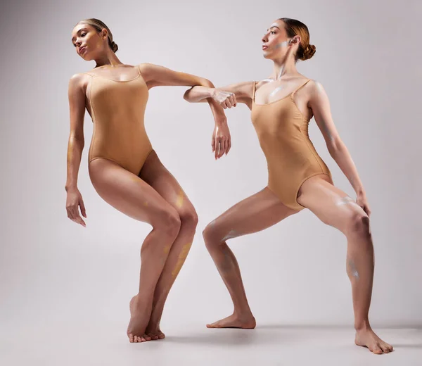 Creative ballet, ballerina and women dance together for stage performance, dancing and training in studio. Collaboration, theatre and females in dancer pose for routine, practice and contemporary art.