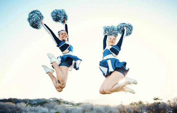 stock image Cheerleader, women team and sports jump outdoor for fitness, training and celebration for win. Teamwork of athlete people together for competition, blue sky and motivation for cheerleading portrait.