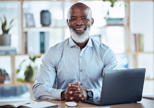 Senior black man, laptop and portrait smile for business leadership, management or Human Resources at office. Happy African American male corporate CEO or HR smiling and sitting by computer desk.