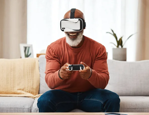 Vr, gaming and senior black man in virtual reality in home on sofa in living room, laughing and having fun. 3d metaverse, esports gamer and happy retired male playing futuristic games with controller.