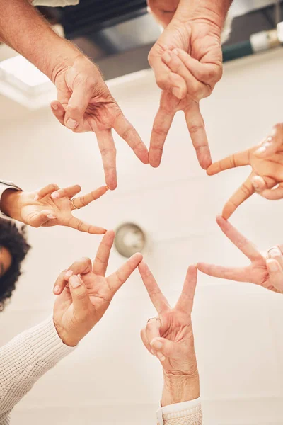 Business people solidarity, together and peace hands sign for company commitment, job unity or collaboration. Group star, mission teamwork and below view of design team building for community support.