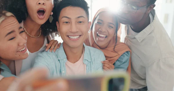 stock image Selfie, tongue and friends with a business team posing together in the office for a funny picture. Social media, teamwork or emoji with a man and woman employee group taking a photograph at work.