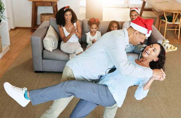 Christmas dancing of happy senior family for celebration, joy and retirement lifestyle together at home. Excited, dance and children clapping for grandparents or mature people on thanksgiving holiday.
