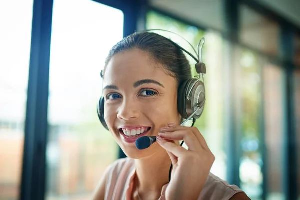 Shot of a young woman working in a call center.