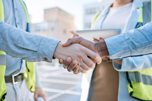 Handshake, engineering and meeting with people and solar panels for partnership, renewable energy or deal. Agreement, sustainability and thank you with engineer shaking hands for eco, b2b or welcome.