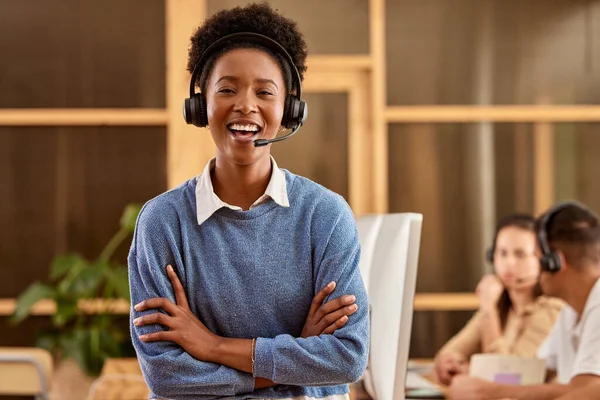 stock image Call center, arms crossed and portrait of black woman laughing at funny joke in customer service office. Crm consulting, proud sales agent and happy telemarketer, representative or female consultant