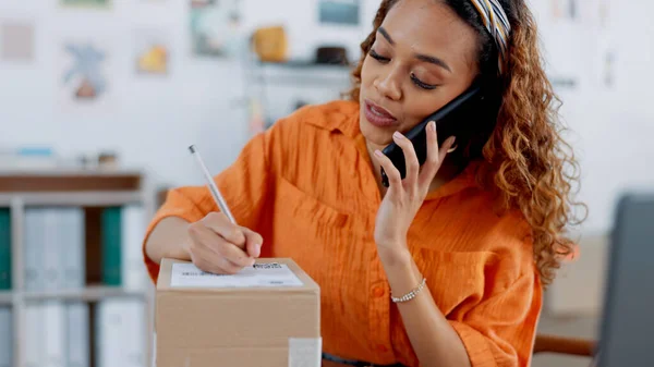 Fashion, phone call and woman with store box for shipping delivery. Small business, logistics and female from Brazil in shop with inventory, stock or cargo signing package while talking on 5g mobile.