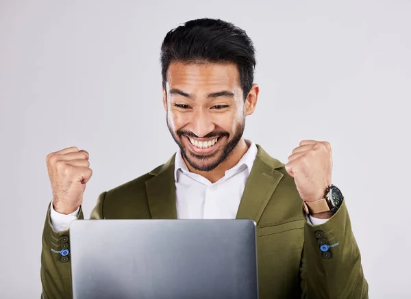 Asian businessman, laptop or success fist on isolated studio background for financial growth, stock market deal or future security. Smile, happy or cheering man with winner hands, technology or loan.