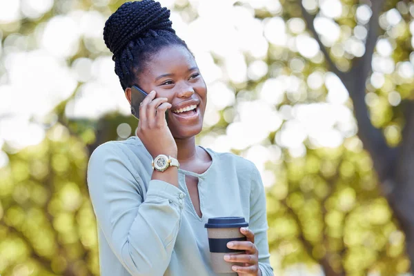 Black woman laugh, phone conversation and morning outdoor with blurred background and planning. Smile, networking and business call on a work break on mobile communication and discussion by trees.