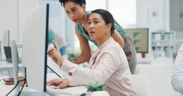 stock image Finance, documents and collaboration with a business black woman talking to a colleague in the office. Teamwork, planning and strategy with a graph or chart on a computer screen at work.