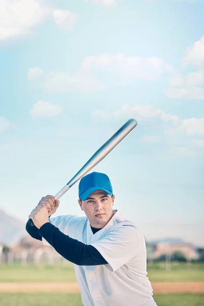 Im here to win. Shot of a young baseball player holding a baseball bat  while posing outside on the pitch Stock Photo - Alamy