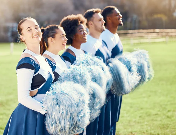 Happy, sports and portrait of a cheerleader with a team for support, formation and motivation. Smile, teamwork and men and women cheering for sport, event or celebration on a field for cheerleading.