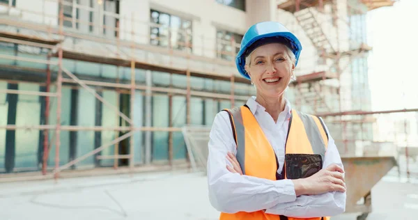 Architecture, engineer and business woman in construction site portrait for office building or commercial property development. Proud civil engineering manager, construction worker or contractor boss.