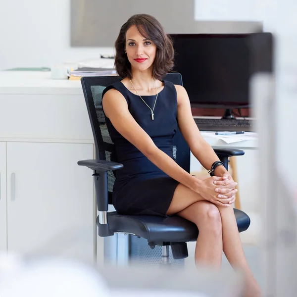 stock image My company works like a well-oiled machine. Portrait of a young designer sitting at her workstation in an office