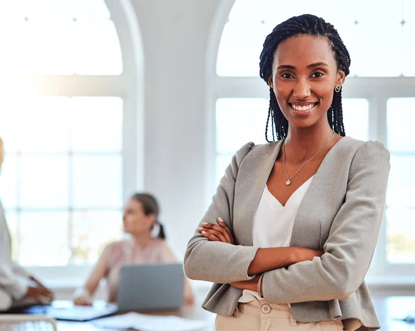 Black woman, entrepreneur and leader stand in office happy, proud or confident in business, project and with cross arms. Portrait, African American female or smile empowerment in successful workspace.