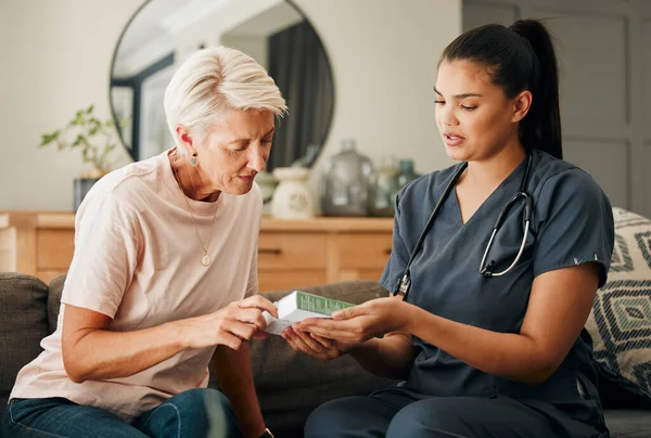 Home, healthcare and doctor help elderly patient in assisted living care facility, explain medicine on a sofa. Support, pills and senior care checkup with nurse discuss option and recovery treatment.