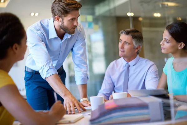 stock image Look at these numbers. a group of coworkers in a business meeting