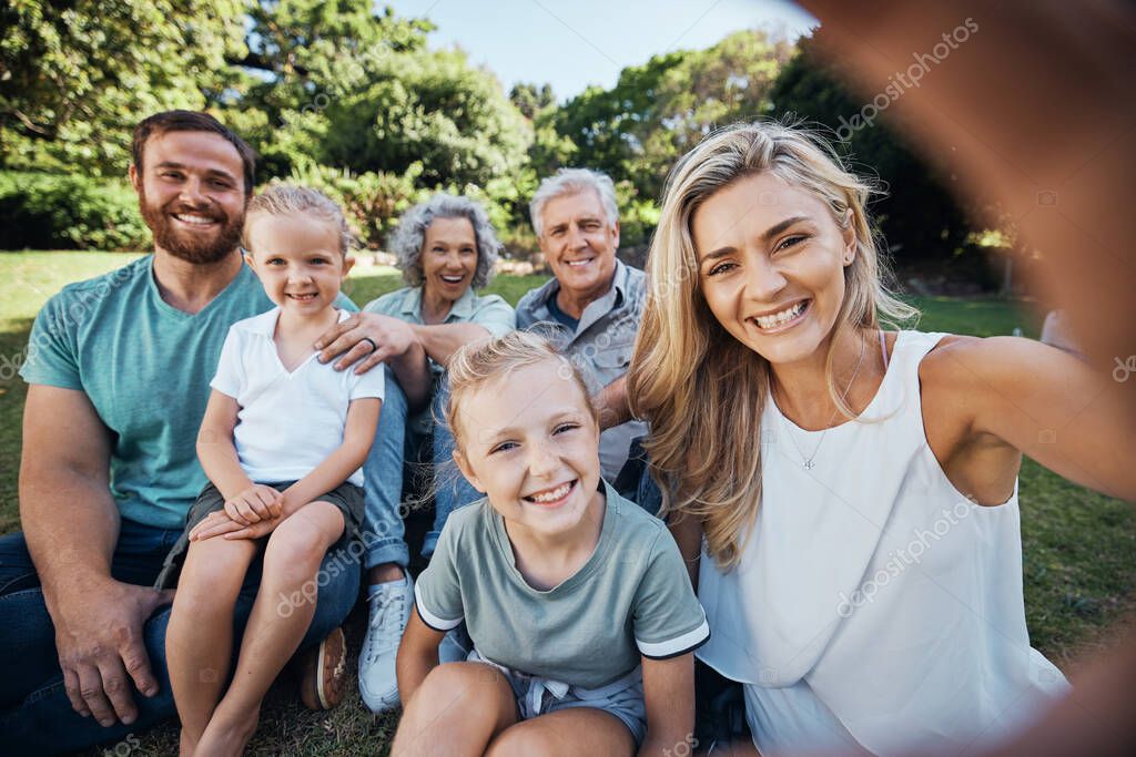 Family selfie, park portrait and woman with smile on holiday in nature in Canada during summer. Parents, girl kids and grandparents taking photo on vacation in a green garden for picnic in spring.