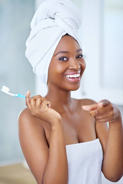 Your teeth deserve to sparkle. a beautiful young woman during her daily beauty routine