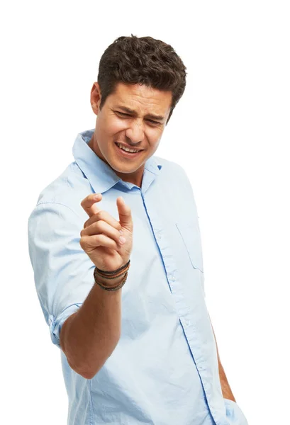 一个英俊的年轻人 用他的大拇指和食指与白色的背景相对应 — 图库照片