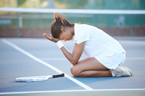 Tennis, stress and woman with depression on court after failure in match, game or competition. Mental health, anxiety and sad female athlete with headache, migraine or exhausted after sports exercise.